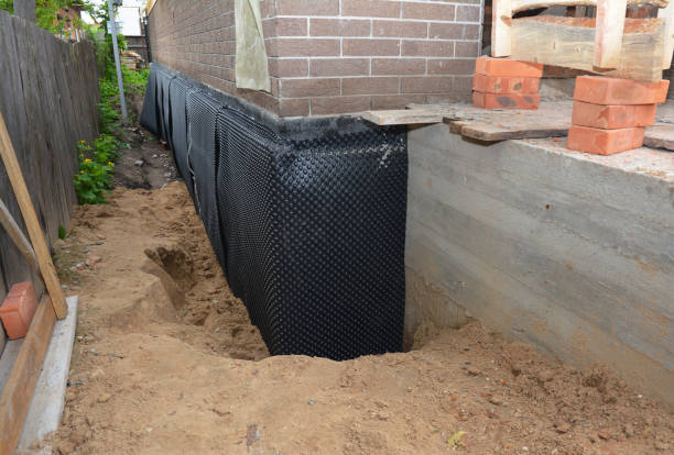 SJ Waterproofing Pros technician performing targeted Waterproofing assessment in Stapleton, AL
